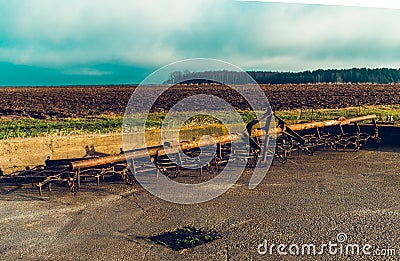 Agricultural steal tine harrow, used in the field Stock Photo