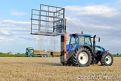 Agricultural traktor with hay bails Stock Photo