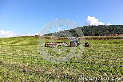 Agricultural work performed with a tractor Editorial Stock Photo