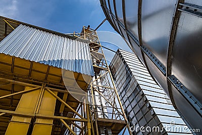 Agro-processing and manufacturing plant for processing and silver silos for drying cleaning and storage of agricultural products, Stock Photo