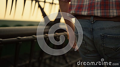 Agronomist inspect field farming vehicle at golden sunset countryside closeup Stock Photo