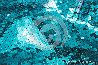 AI aqua blue trendy color of year 2021 sequin fabric texture. Shiny sparkling background. Clothing piece of glitter Stock Photo