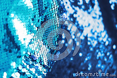 AI aqua blue trendy color of year 2021 sequin fabric texture. Shiny sparkling background. Clothing piece of glitter Stock Photo