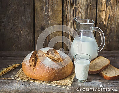 Fresh milk and newly baked bread Stock Photo