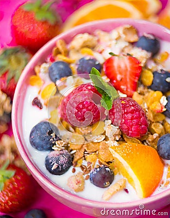 Fruit, berries, and granola in bowl Stock Photo