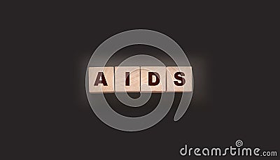 AIDS letters on wooden cubes. STD sexually transmitted diseases Stock Photo