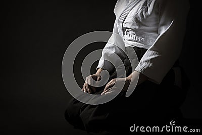 Aikido Hakama Sitting Pose Over Black Stock Photo