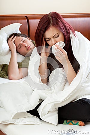 Ailing couple in bedroom Stock Photo