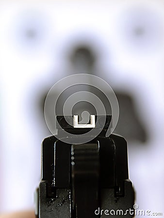 Aiming gun at target Stock Photo