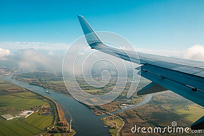 Aiplane wing, landscape aerial and blue sky Stock Photo