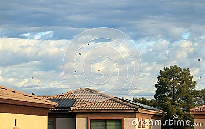 Air balloons floating in a Cloudy Sky Stock Photo