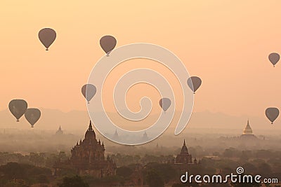 air balloons over Buddhist temples at sunrise. Bagan, Myanmar. Stock Photo