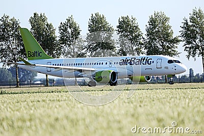 AirBaltic jet plane taxiing to Polderbaan Editorial Stock Photo