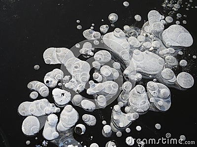Air bubbles trapped in frozen water at Lake Baikal, Siberia, Russia Stock Photo
