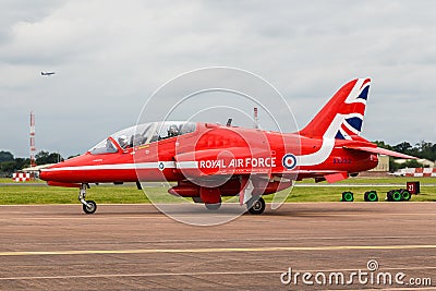 An Air Cadet waves from her back seat of a Red Arrow Editorial Stock Photo