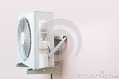 Air compressor, Close-up three external split wall type of outdoor home air conditioner unit installed on outside building. Stock Photo