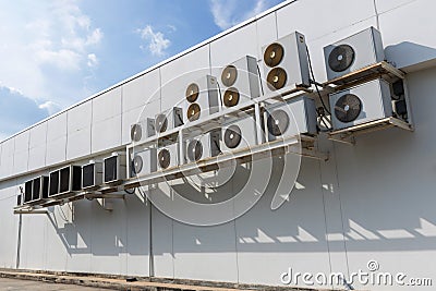 Air conditioner compressor installed in old building. Outdoor split wall type air conditioner compressor unit inverter installed o Stock Photo