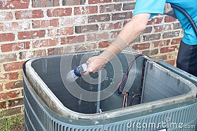 Air conditioner maintenance, compressor condenser coil Stock Photo