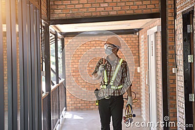 Air conditioner repairmen work on home unit Stock Photo