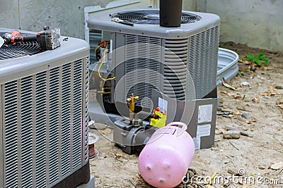 Air conditioning repair system model is actual on a compressor refueling the air conditioner with freon Stock Photo
