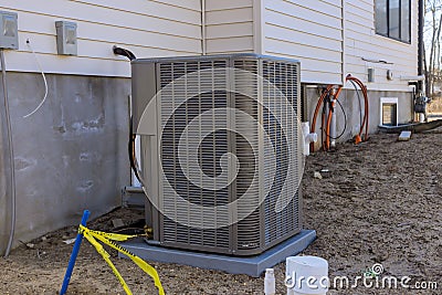 Air conditioning technician to install new air conditioner refueling the air conditioner with freon Stock Photo