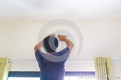 Air conditioning technicians install new air conditioners in homes, Repairman fix air conditioning systems, Air conditioning unit Stock Photo