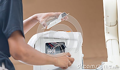 Air conditioning technicians prepare to install new air conditioners in home, Air conditioner repair and installation concepts Stock Photo