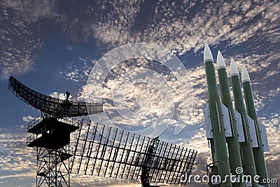 Air defense radars of military mobile anti aircraft systems and modern Russian anti aircraft missiles OSA-AKM on background clouds Stock Photo
