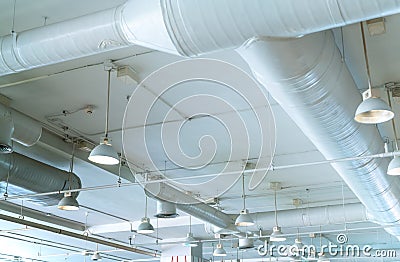 Air duct, air conditioner pipe, wiring pipe, and fire sprinkler system. Air flow and ventilation system. Building interior. Stock Photo