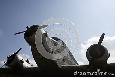 Air forces, aircraft, history, progress, development. Textured grunge old plane, blue sky background. Old plane not able Editorial Stock Photo