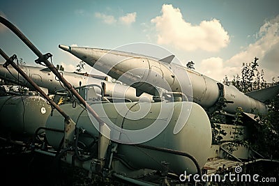 Air forces, aircraft, history, progress, development. Textured grunge old rocket launcher, blue sky background. Old Editorial Stock Photo