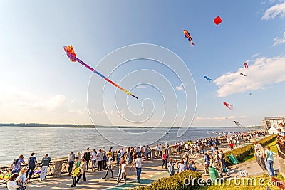 Air inflatable balls fly on the embankment of the Volga on a sports holiday on a sunny day Editorial Stock Photo