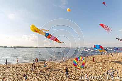 air inflatable balls fly on the embankment of the Volga on a sports holiday on a sunny day Editorial Stock Photo