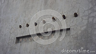 Air and light ventilation on a concrete cement wall outdoor architecture design Stock Photo