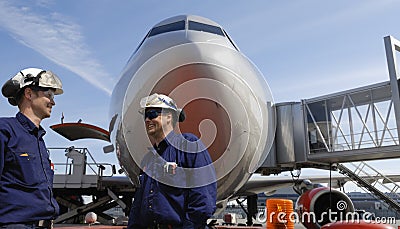 Air mechanics and airliner Stock Photo