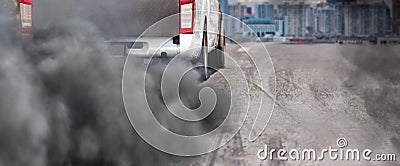 Air pollution from diesel vehicle exhaust pipe on road Stock Photo