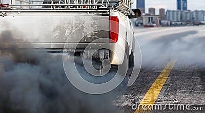 Air pollution crisis in city from diesel vehicle exhaust pipe on road Stock Photo