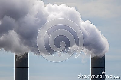 Air pollution from a power station chimneys Stock Photo