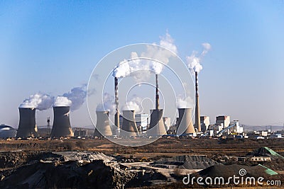 Air pollution by smoke coming out of from factory`s chimneys, Industrial zone Stock Photo