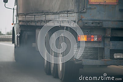 Air pollution from truck vehicle exhaust pipe on road Stock Photo