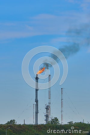 Air polution generated by oil refinery in Midia Romania Flames and smoke Stock Photo