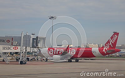 An AirAsia airplane docking at the Changi airport in Singapore Editorial Stock Photo