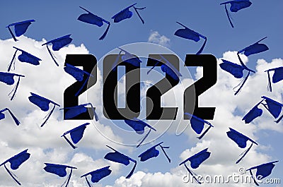 Airborne Blue Graduations Caps In Sky Stock Photo