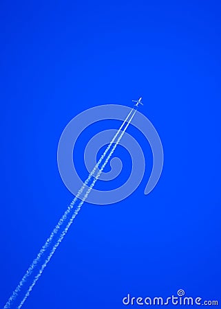 Airborne jet on blue sky Stock Photo