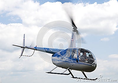 Airborne Robinson R-44 helicopter Editorial Stock Photo