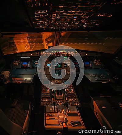 Airbus A319 aircraft illuminated interior without pilots at night Editorial Stock Photo