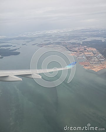 Airbus A330 in a banking right turn in flight Editorial Stock Photo