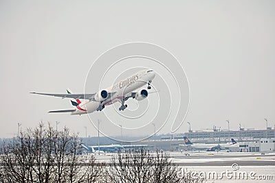 Airbus A380 Emirates plane flying over Munich Airport, Germany Editorial Stock Photo