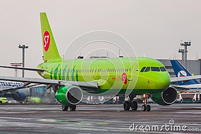Airbus A320 S7 Airlines taxis at the Moscow airport Domodedovo Editorial Stock Photo