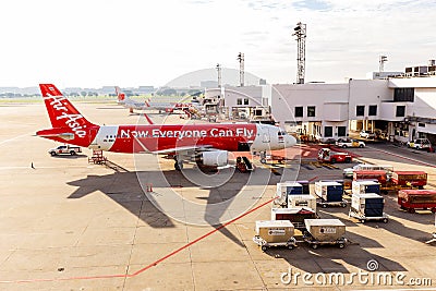 Airbus A320-200 Thai Airasia connected to jetway at Don Muang in Editorial Stock Photo